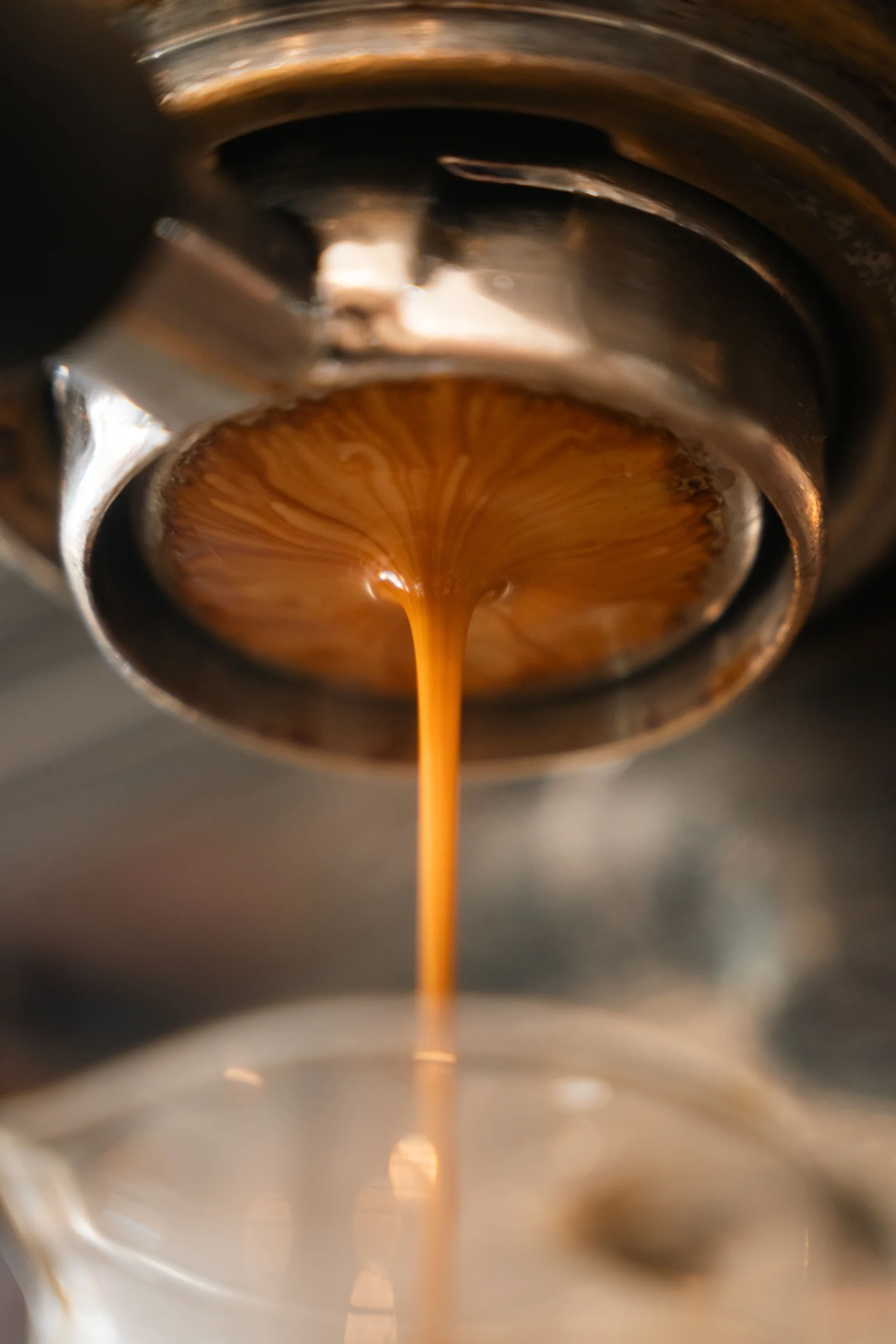 Espresso streaming from a portafilter on an espresso machine